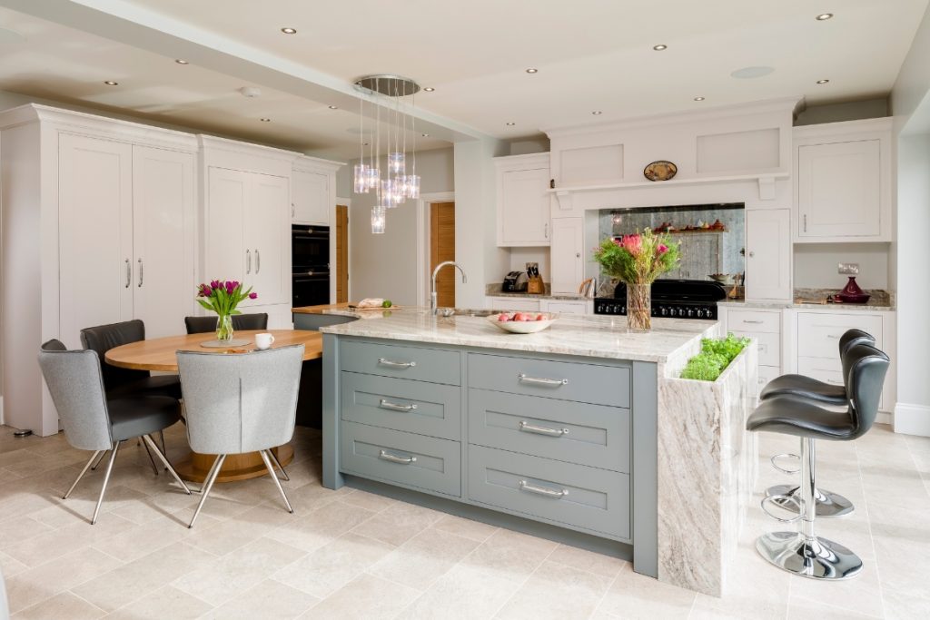 A kitchen island in a light country kitchen